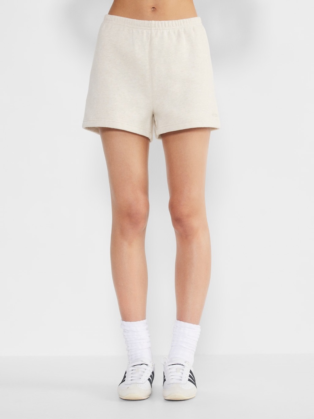 aritzia | perfect fit high rise mini short in heather light oatmeal size medium